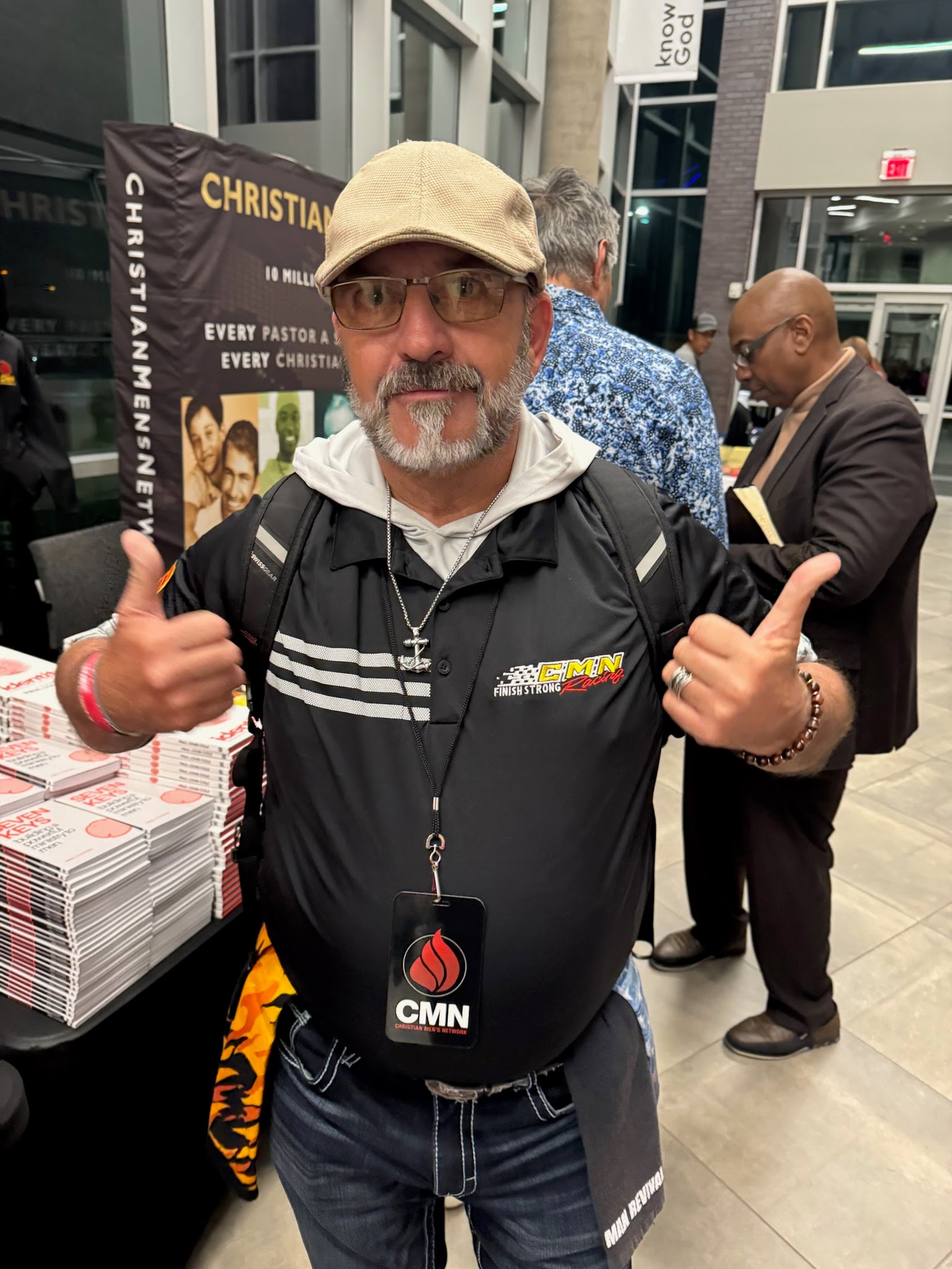 A supporter wearing CMN Racing gear and giving a thumbs up